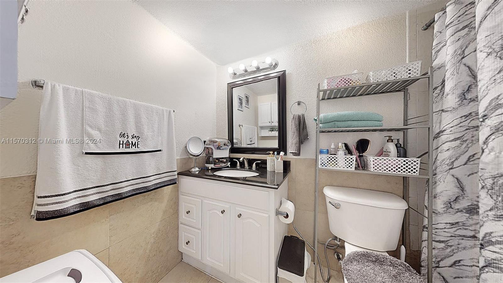 9483 Southwest 76th Street, Unit N3 Miami, FL 33173 - Photo 19 of 27 a kitchen with a refrigerator sink and wooden floor