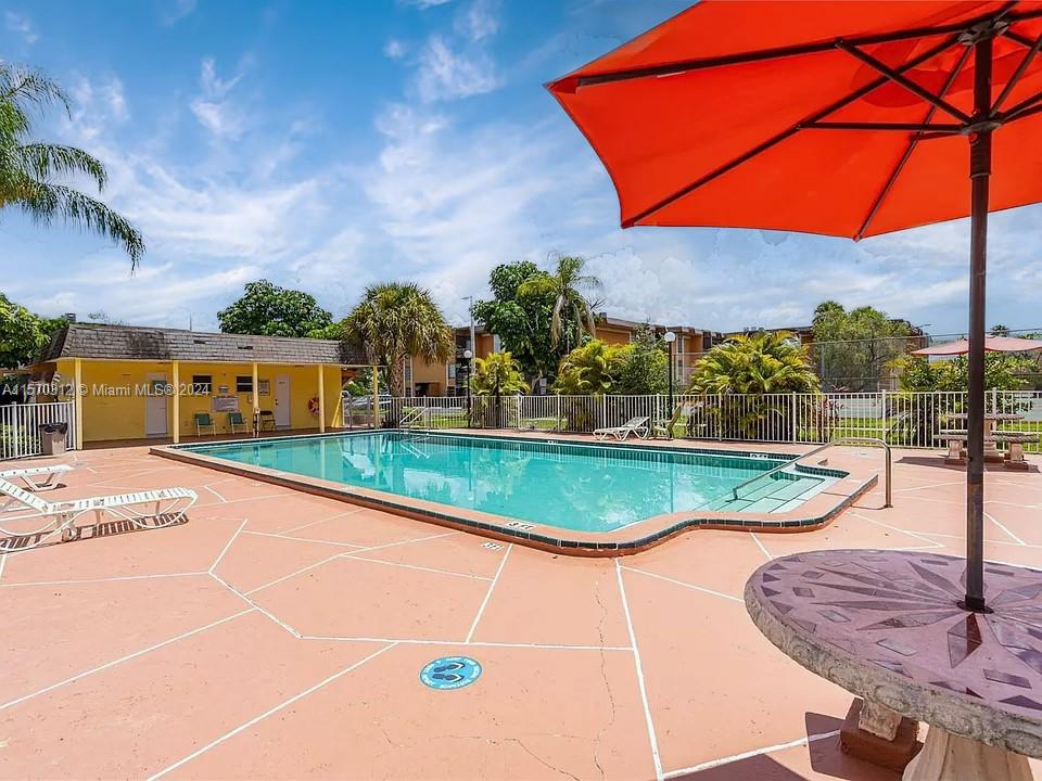 9483 Southwest 76th Street, Unit N3 Miami, FL 33173 - Photo 21 of 27 a view of a backyard with swimming pool