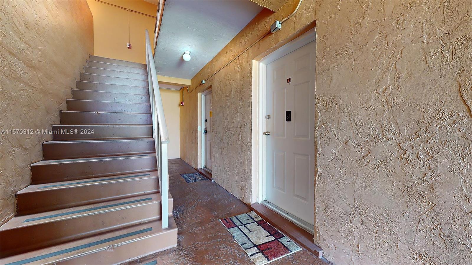 9483 Southwest 76th Street, Unit N3 Miami, FL 33173 - Photo 24 of 27 a view of entryway with wooden floor