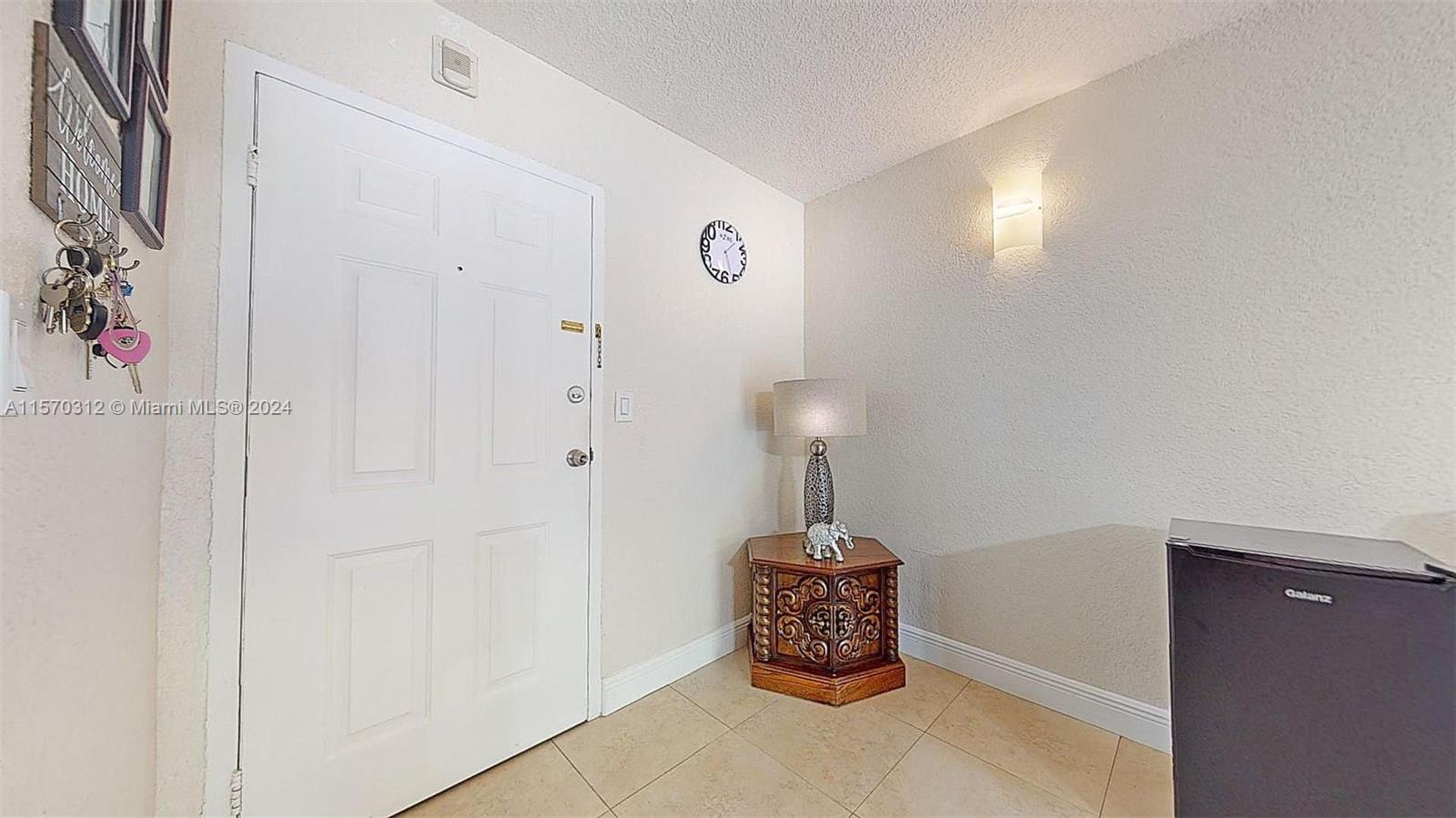 9483 Southwest 76th Street, Unit N3 Miami, FL 33173 - Photo 8 of 27 a close view of a refrigerator in a room