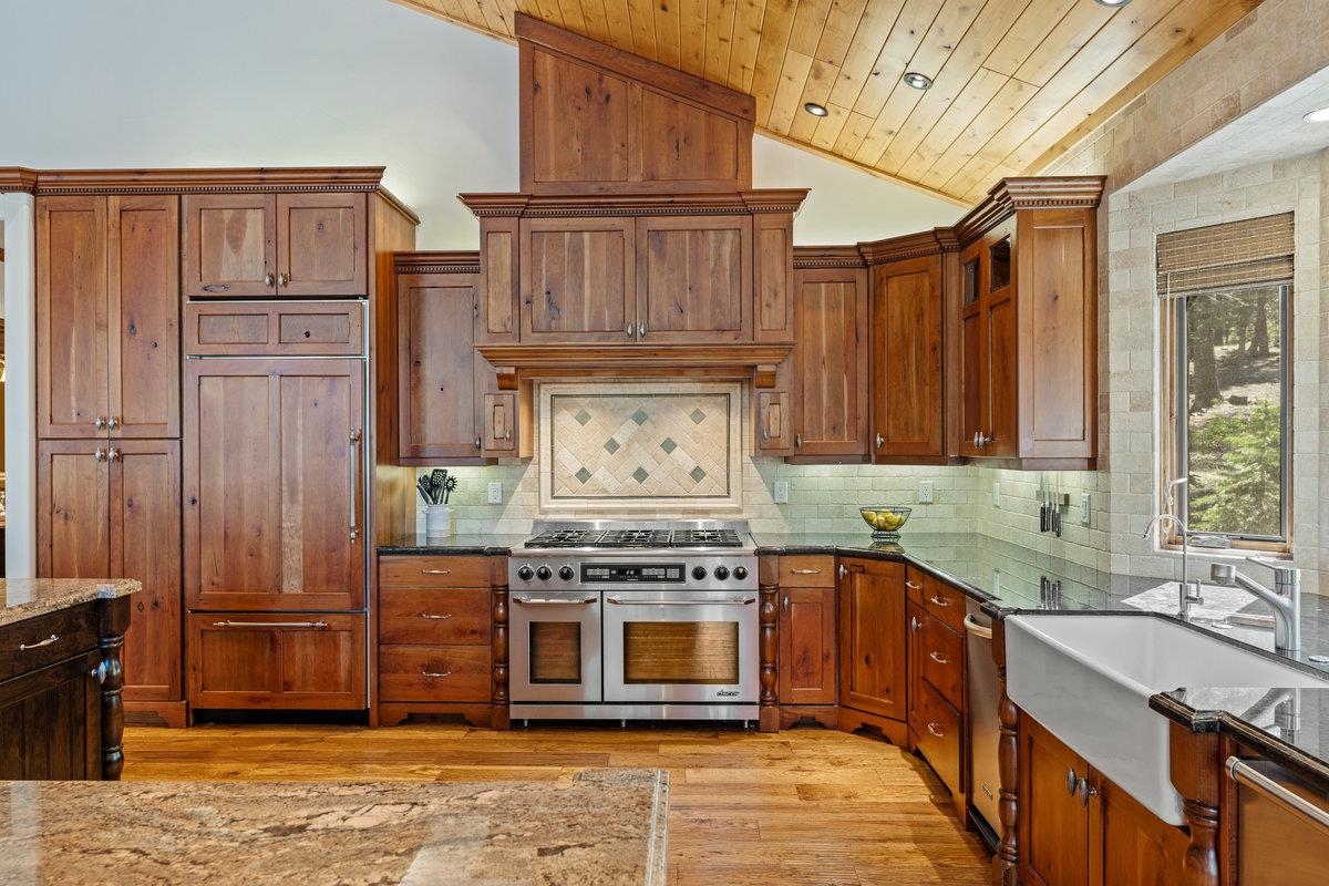 12043 Brookstone Drive Truckee, CA 96161 - Photo 11 of 21 a kitchen with stainless steel appliances granite countertop a stove top oven a sink and dishwasher