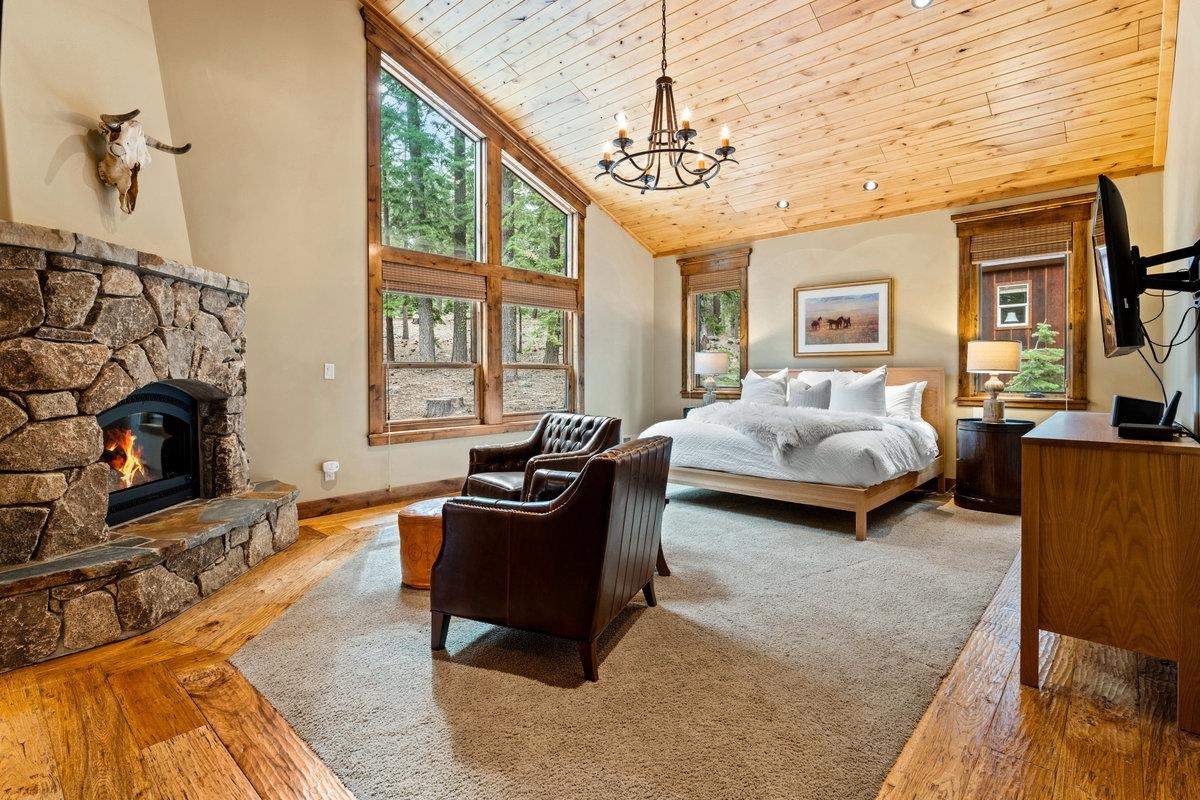 12043 Brookstone Drive Truckee, CA 96161 - Photo 14 of 21 a bedroom with furniture and a fireplace