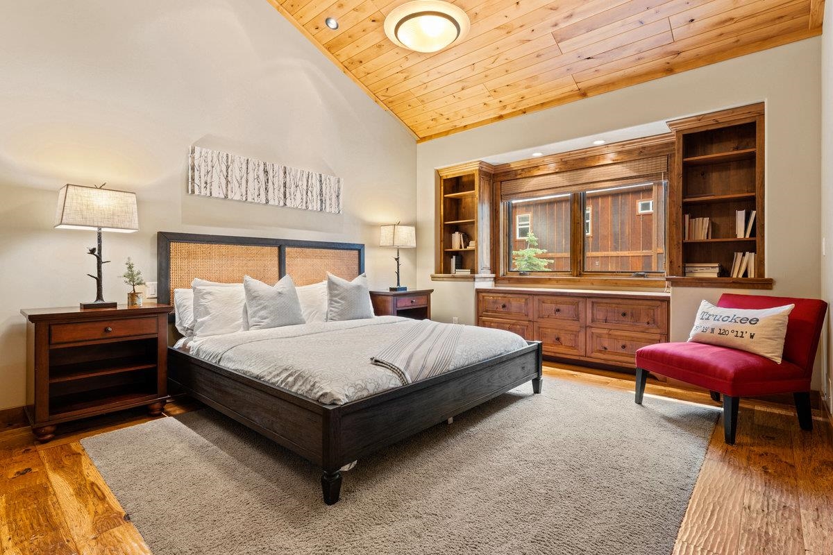 12043 Brookstone Drive Truckee, CA 96161 - Photo 21 of 21 a spacious bedroom with a bed and a couch