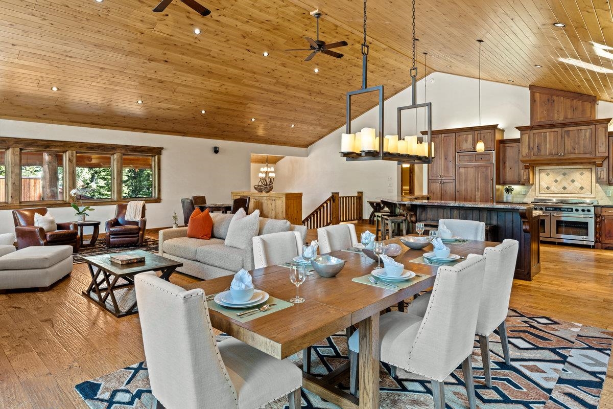 12043 Brookstone Drive Truckee, CA 96161 - Photo 4 of 21 a living room with lots of furniture and a dining table