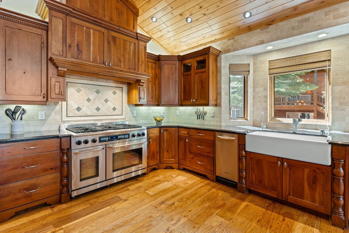 12043 Brookstone Drive Truckee, CA 96161 - Photo 8 of 21 a kitchen with stainless steel appliances granite countertop a stove and a refrigerator
