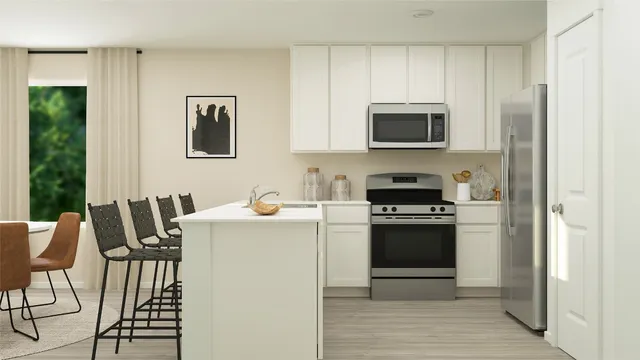 a kitchen with stainless steel appliances a stove a sink refrigerator and a microwave