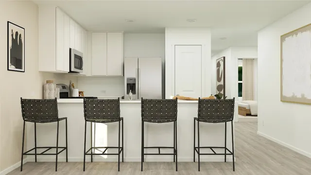 a view of kitchen and dining area with furniture