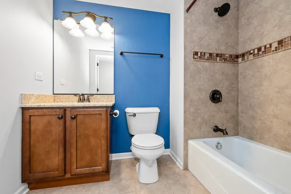 a bathroom with a toilet a sink and bathtub