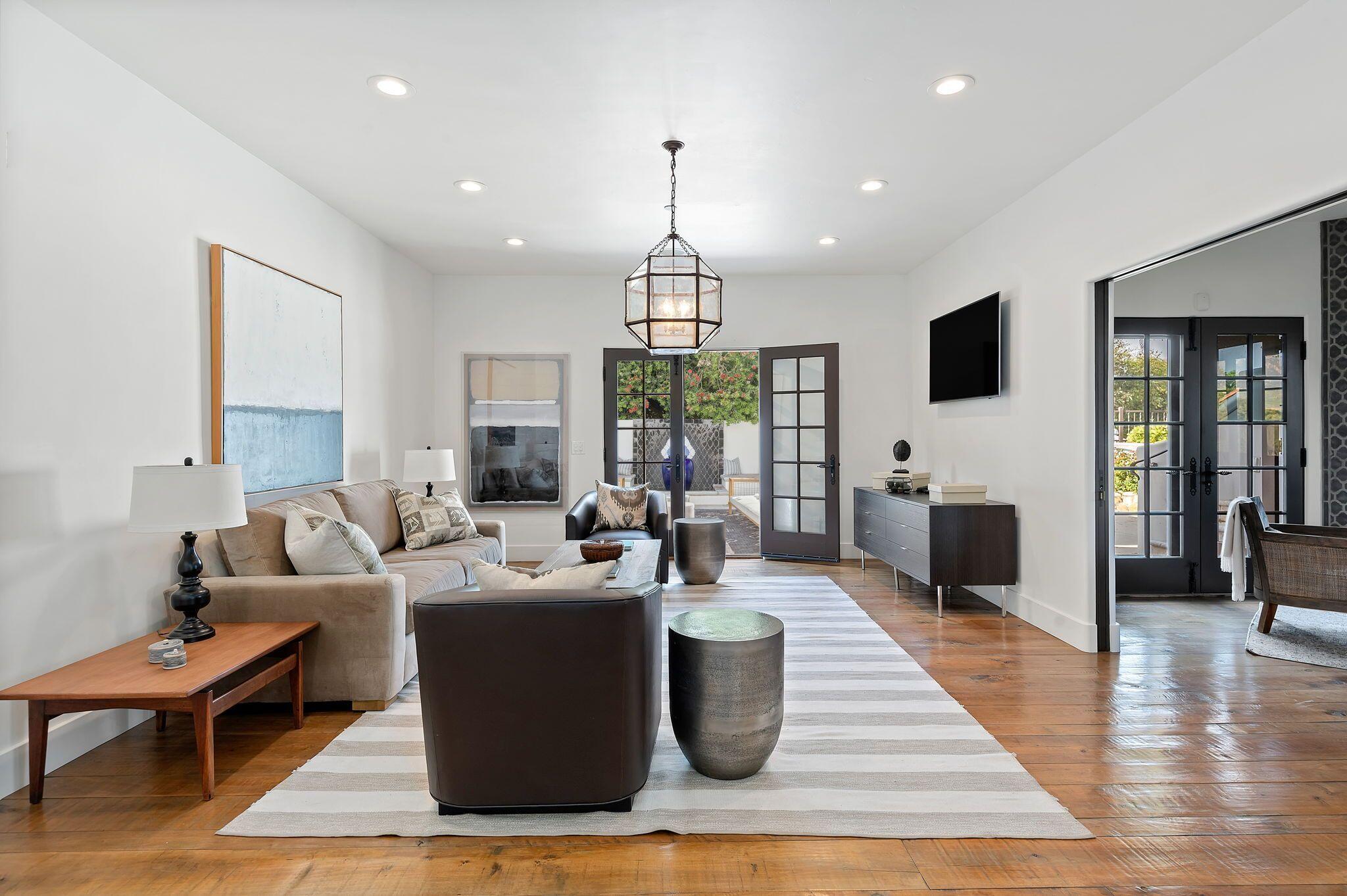 695 Via Hierba Santa Barbara, CA 93110 - Photo 16 of 70 a living room with furniture a fireplace and a flat screen tv