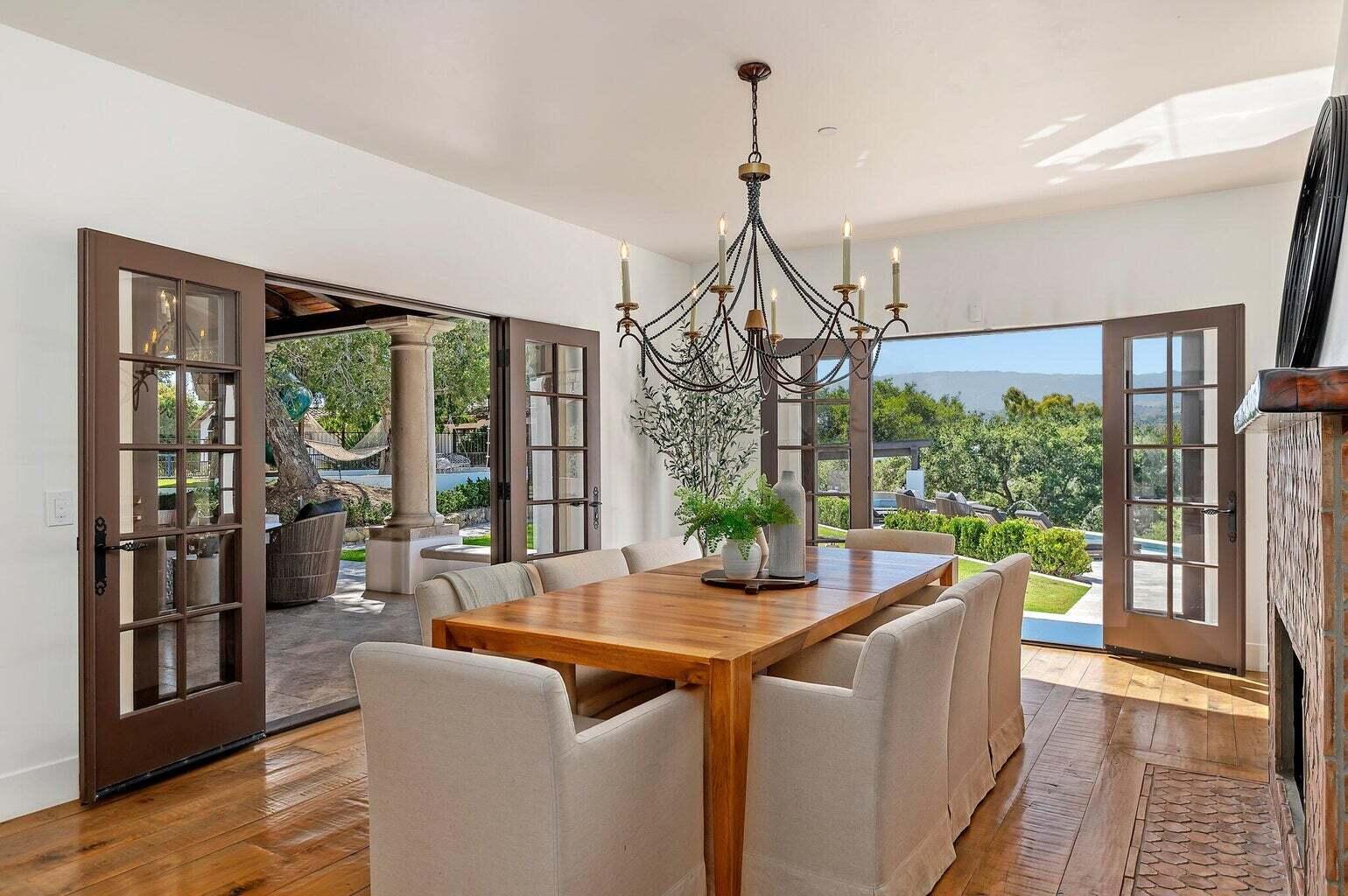 695 Via Hierba Santa Barbara, CA 93110 - Photo 24 of 70 a view of a dining room with furniture wooden floor and chandelier