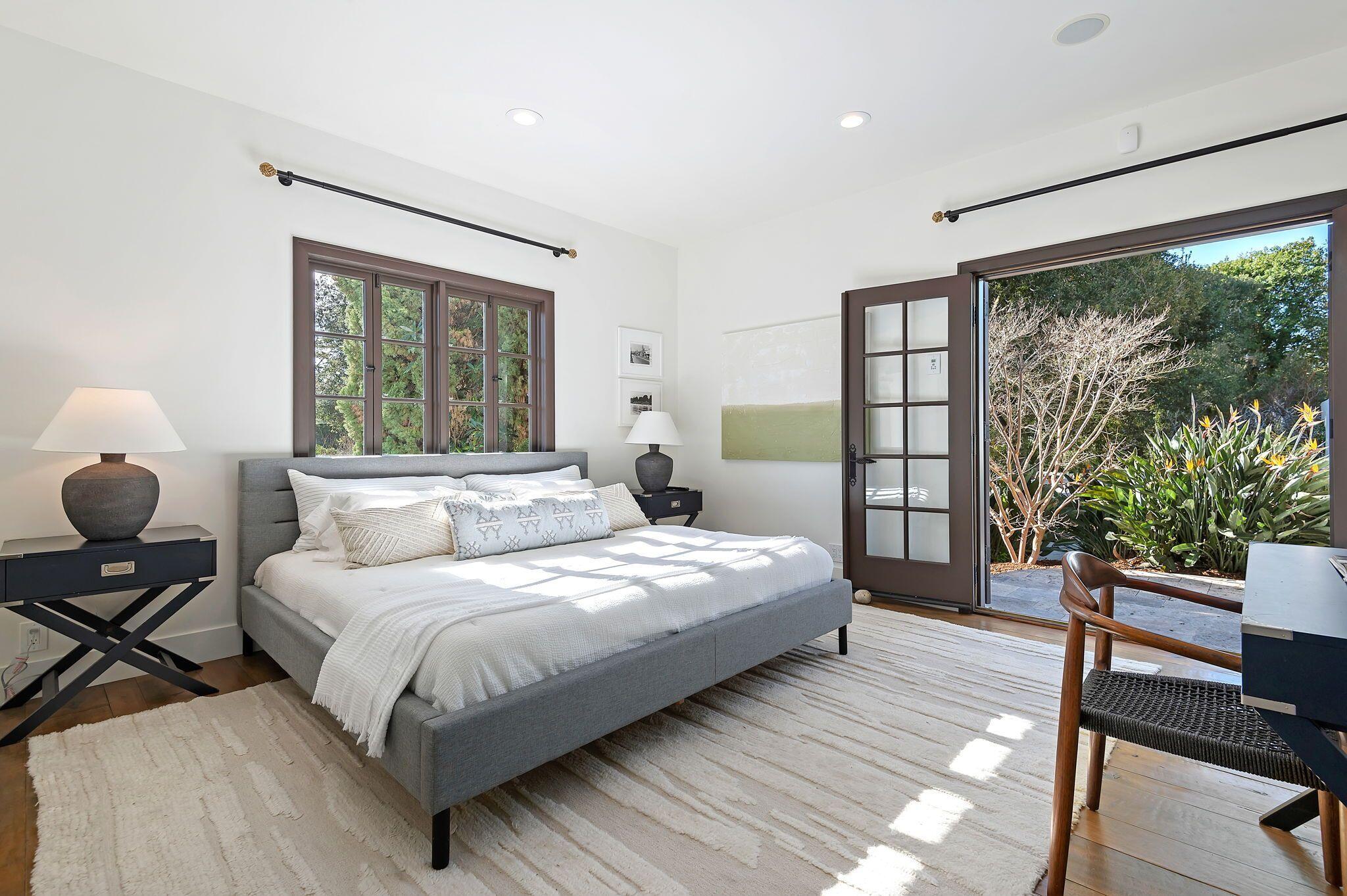 695 Via Hierba Santa Barbara, CA 93110 - Photo 30 of 70 a bedroom with a bed and large windows