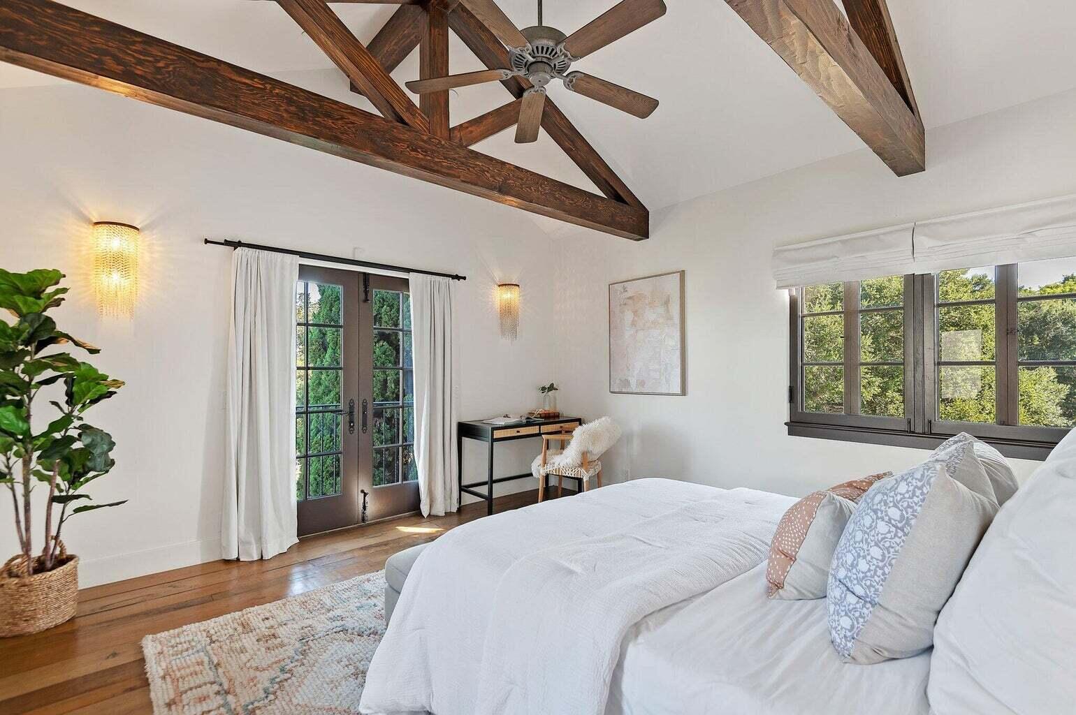 695 Via Hierba Santa Barbara, CA 93110 - Photo 32 of 70 a bedroom with a large bed and a potted plant