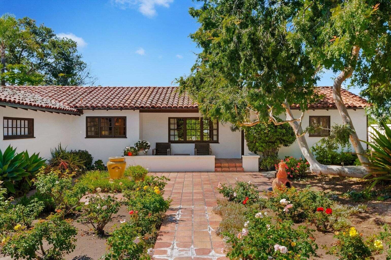 695 Via Hierba Santa Barbara, CA 93110 - Photo 37 of 70 front view of a house with a bench