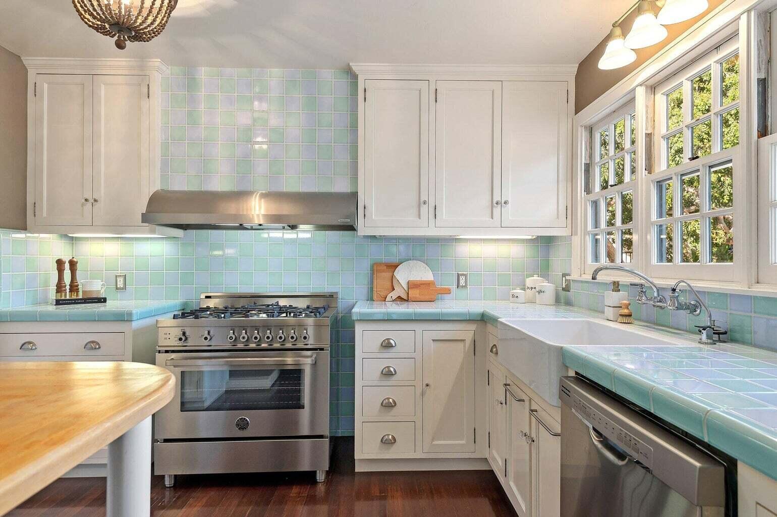 695 Via Hierba Santa Barbara, CA 93110 - Photo 40 of 70 a kitchen with granite countertop a stove sink and cabinets