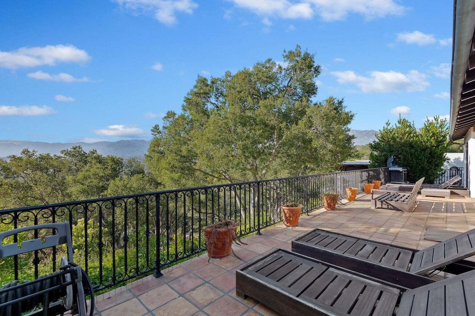 695 Via Hierba Santa Barbara, CA 93110 - Photo 45 of 70 a balcony with wooden floor table and chairs