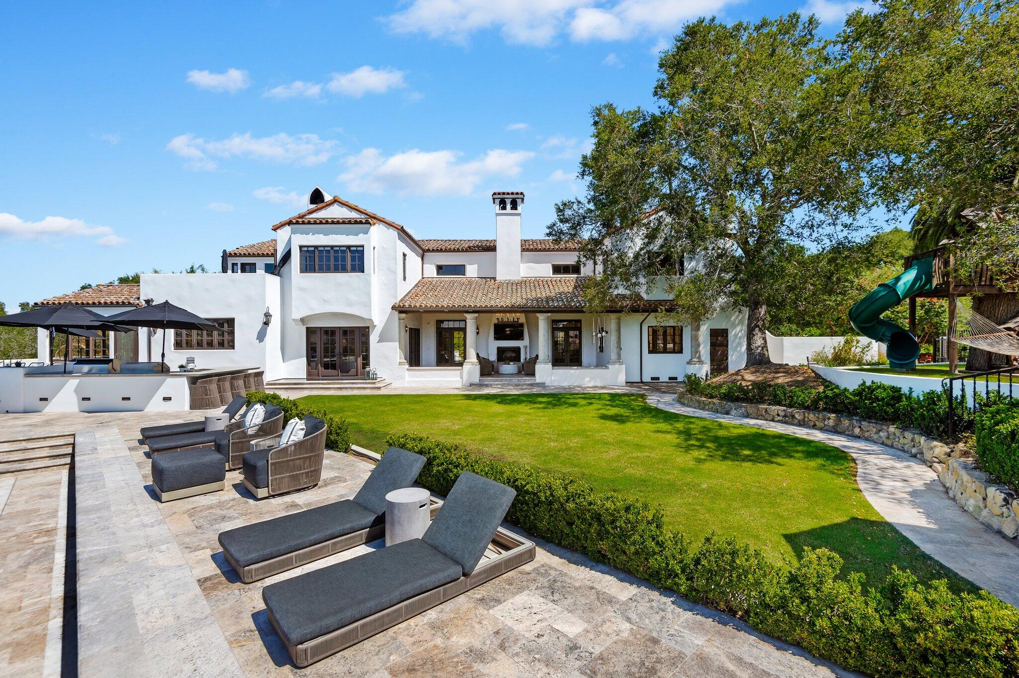 695 Via Hierba Santa Barbara, CA 93110 - Photo 47 of 70 a front view of a house with a yard table and chairs
