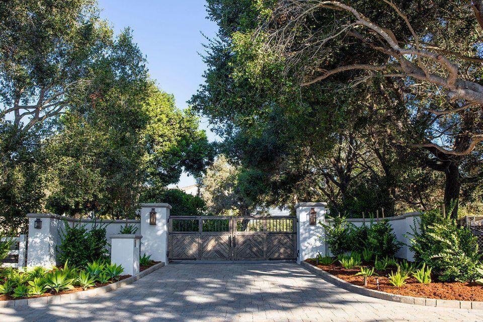 695 Via Hierba Santa Barbara, CA 93110 - Photo 5 of 70 a view of a street with potted plants and large trees