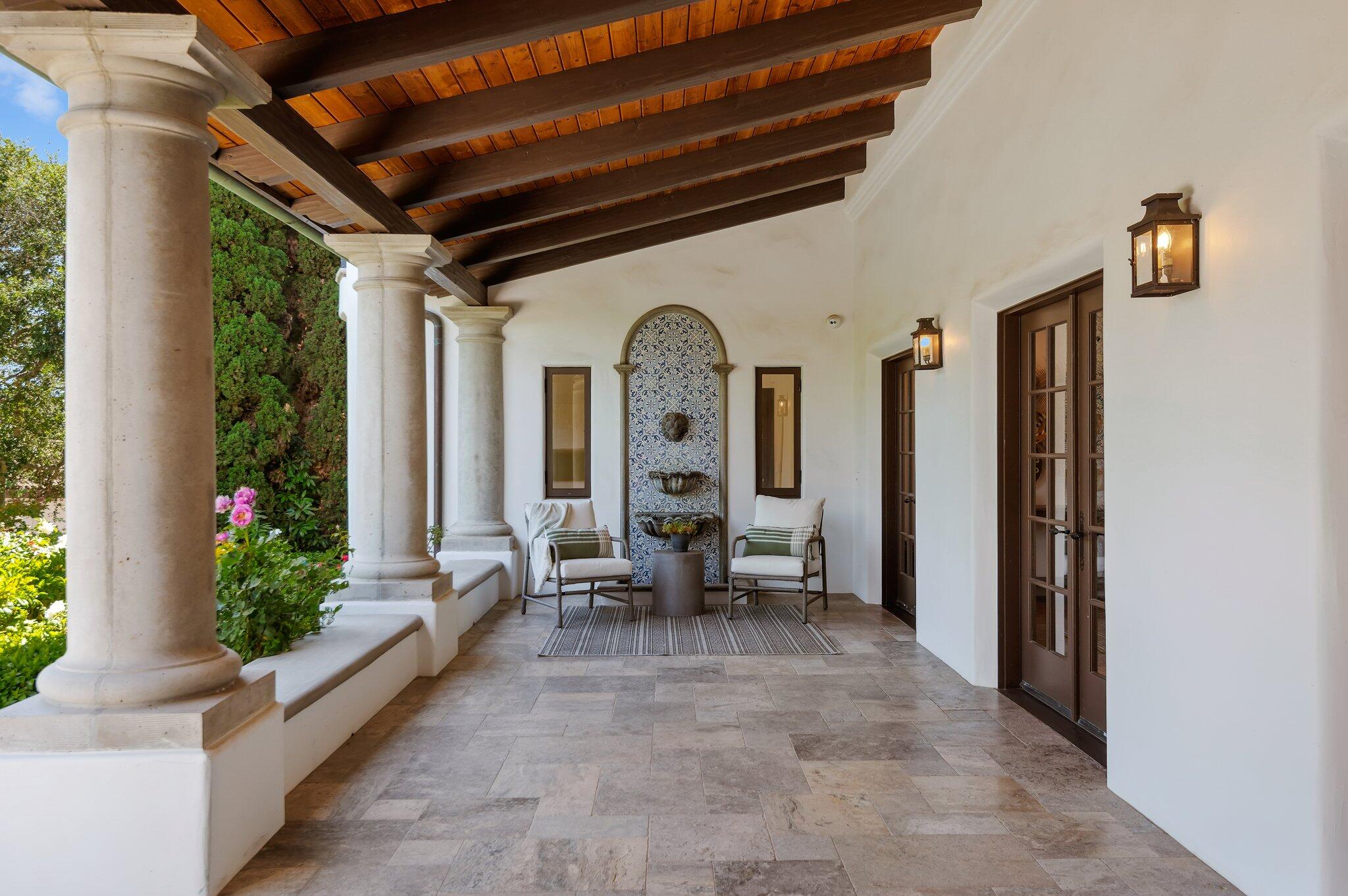 695 Via Hierba Santa Barbara, CA 93110 - Photo 8 of 70 a view of a porch with chairs and potted plants
