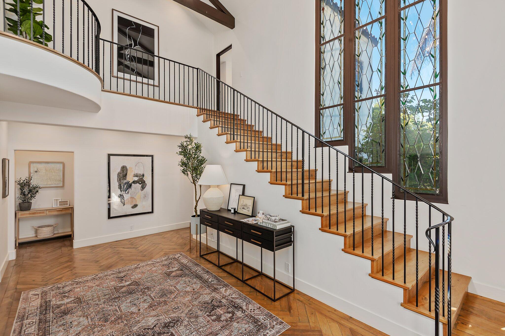 695 Via Hierba Santa Barbara, CA 93110 - Photo 9 of 70 a view of staircase with lots of frames on wall and a window