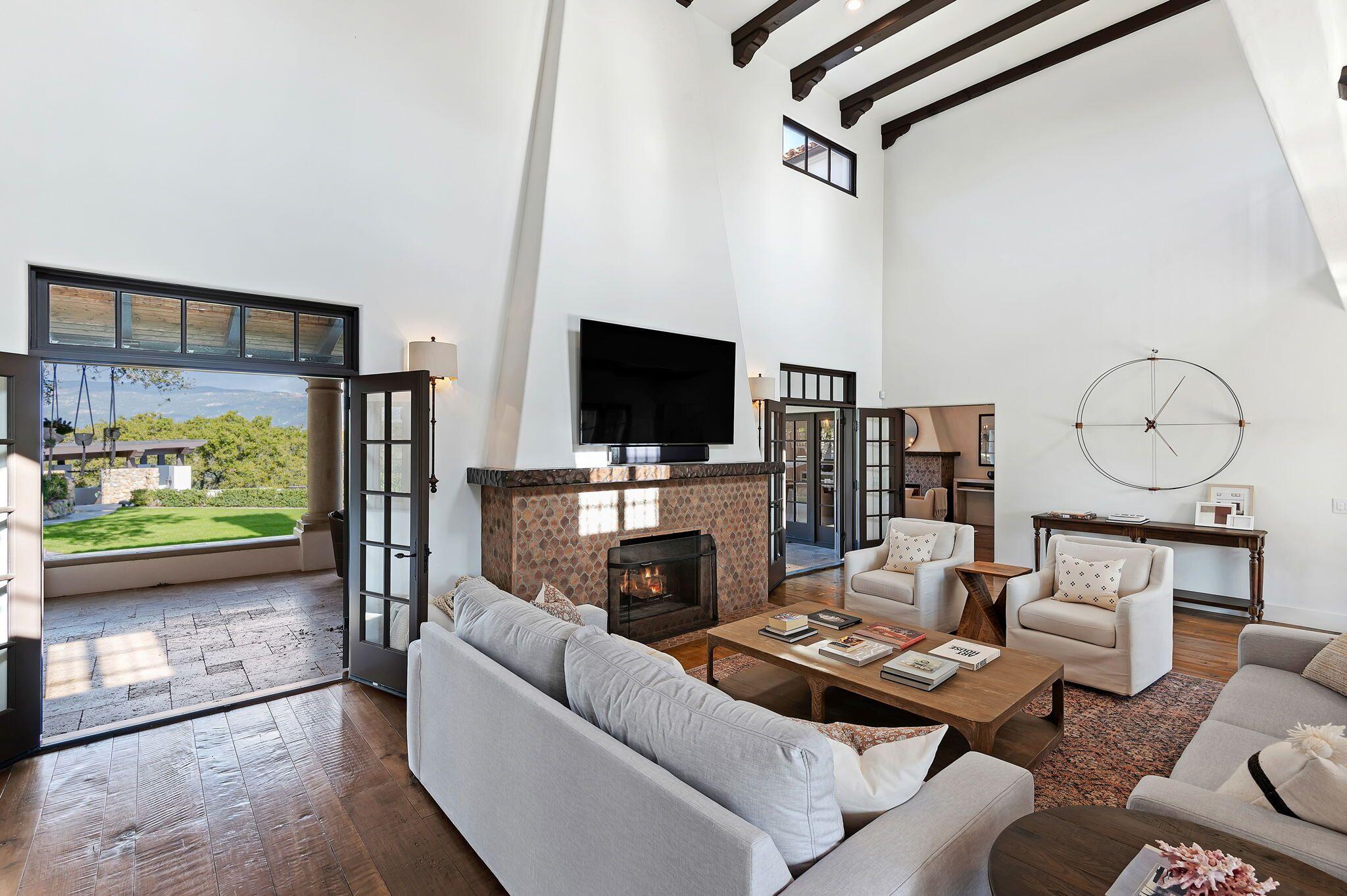 695 Via Hierba Santa Barbara, CA 93110 - Photo 10 of 70 a living room with fireplace furniture and a flat screen tv