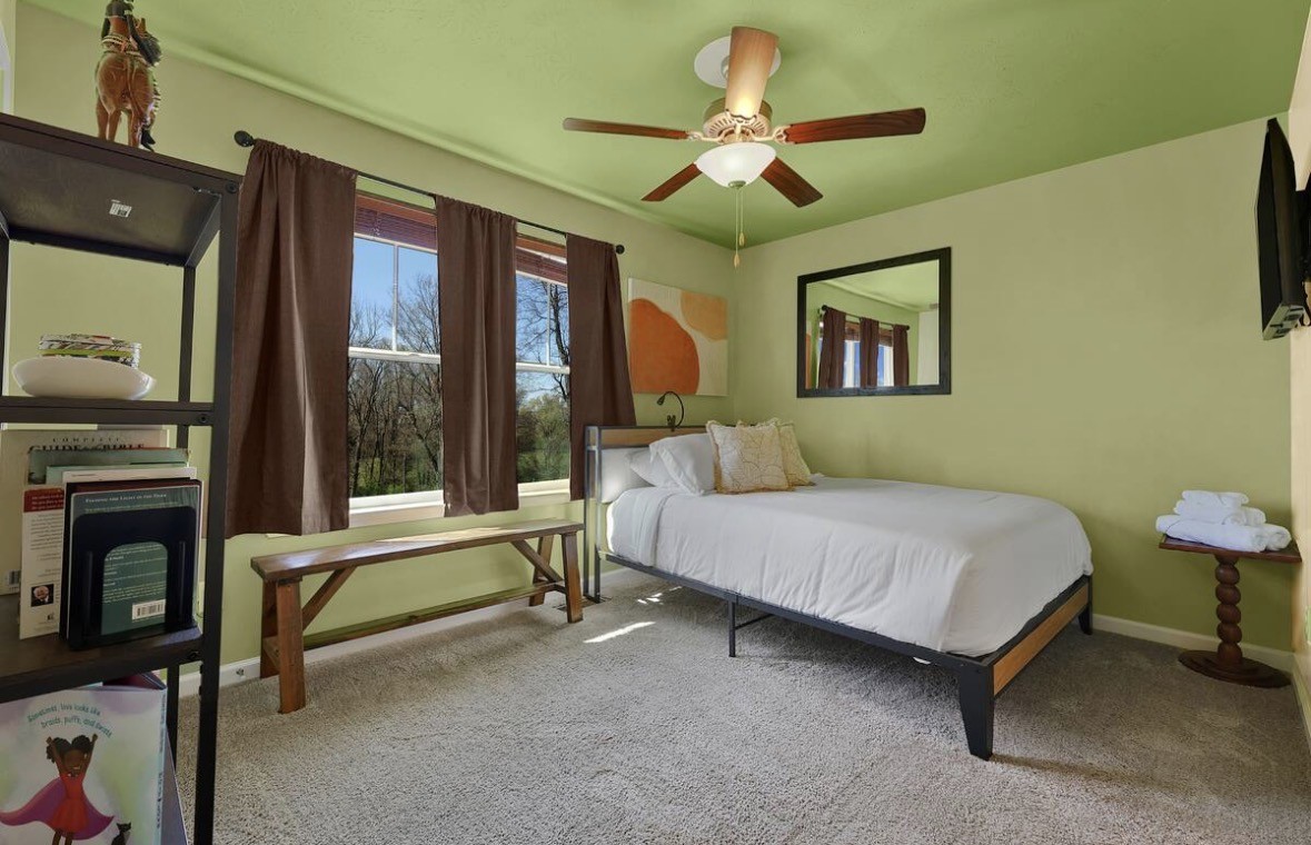 1382 Rural Hill Road, Unit 364 Antioch, TN 37013 - Photo 13 of 22 a bedroom with a bed and a chandelier