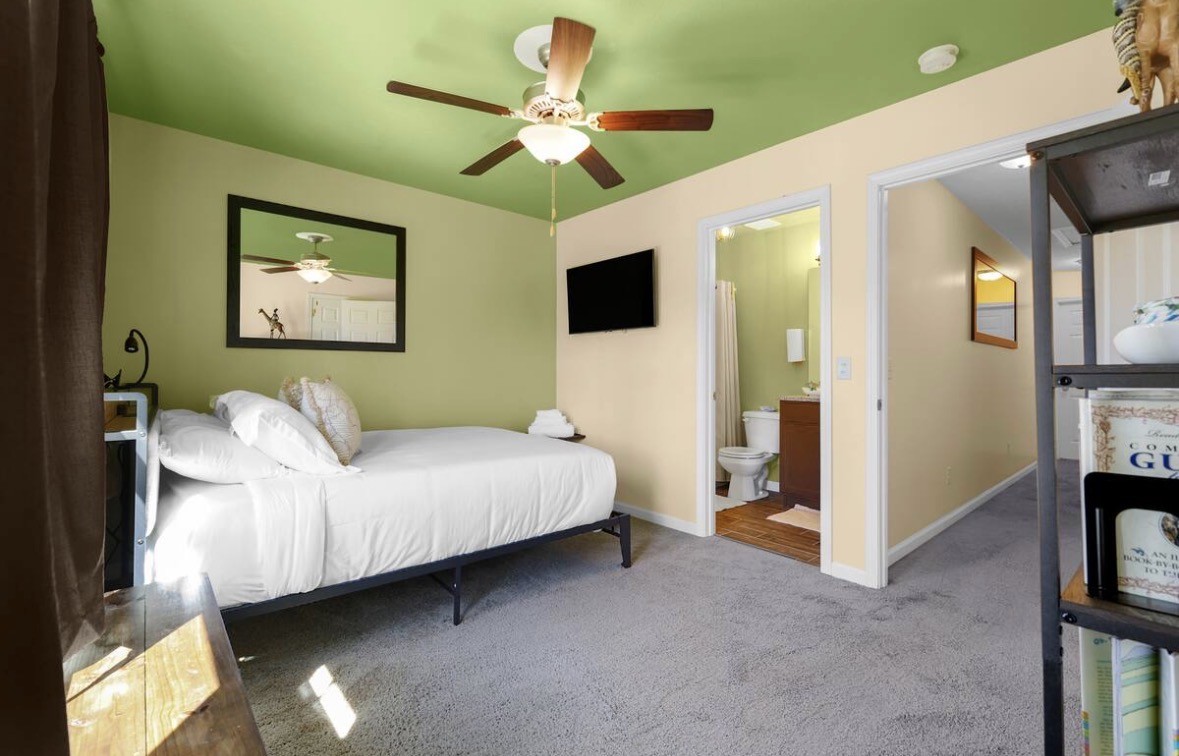 1382 Rural Hill Road, Unit 364 Antioch, TN 37013 - Photo 14 of 22 a spacious bedroom with a bed and a flat screen tv
