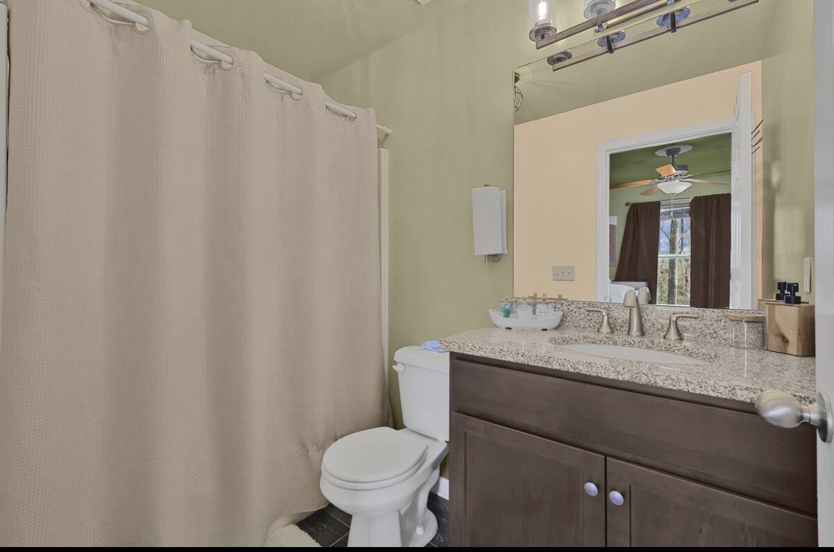 1382 Rural Hill Road, Unit 364 Antioch, TN 37013 - Photo 16 of 22 a bathroom with a granite countertop sink and a mirror