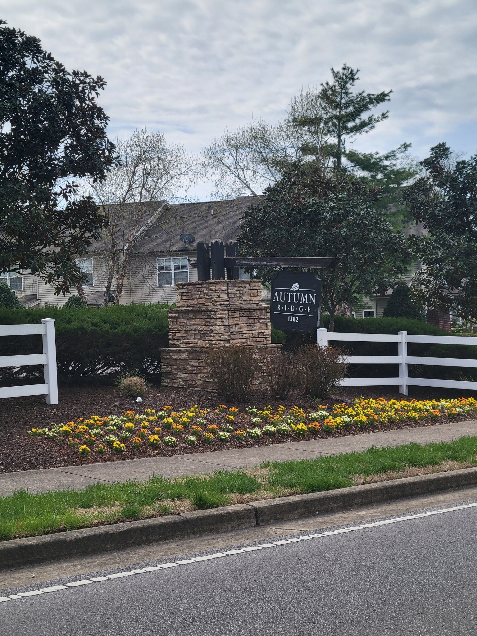 1382 Rural Hill Road, Unit 364 Antioch, TN 37013 - Photo 22 of 22 a view of a house with a small yard and a large parking space