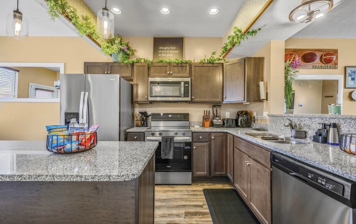 1382 Rural Hill Road, Unit 364 Antioch, TN 37013 - Photo 5 of 22 a kitchen with stainless steel appliances granite countertop a sink refrigerator and cabinets