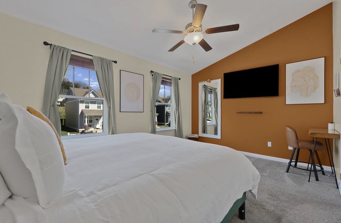 1382 Rural Hill Road, Unit 364 Antioch, TN 37013 - Photo 9 of 22 a bedroom with a bed and a flat screen tv