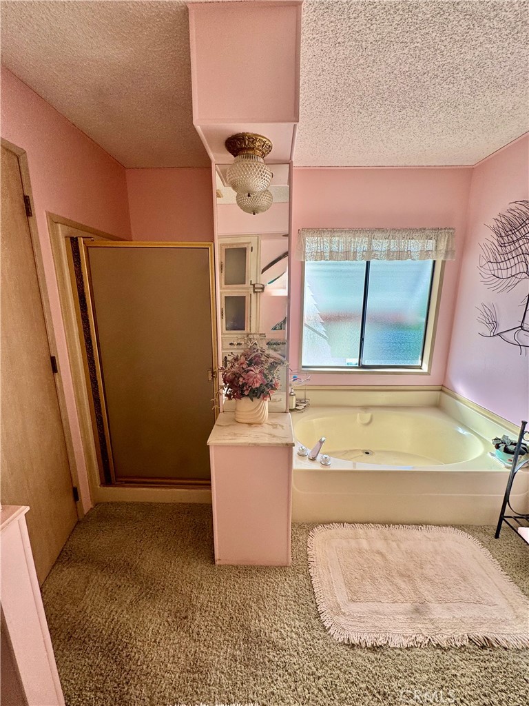 8651 Foothill, Unit 157 Rancho Cucamonga, CA 91730 - Photo 11 of 13 a living room with a couch