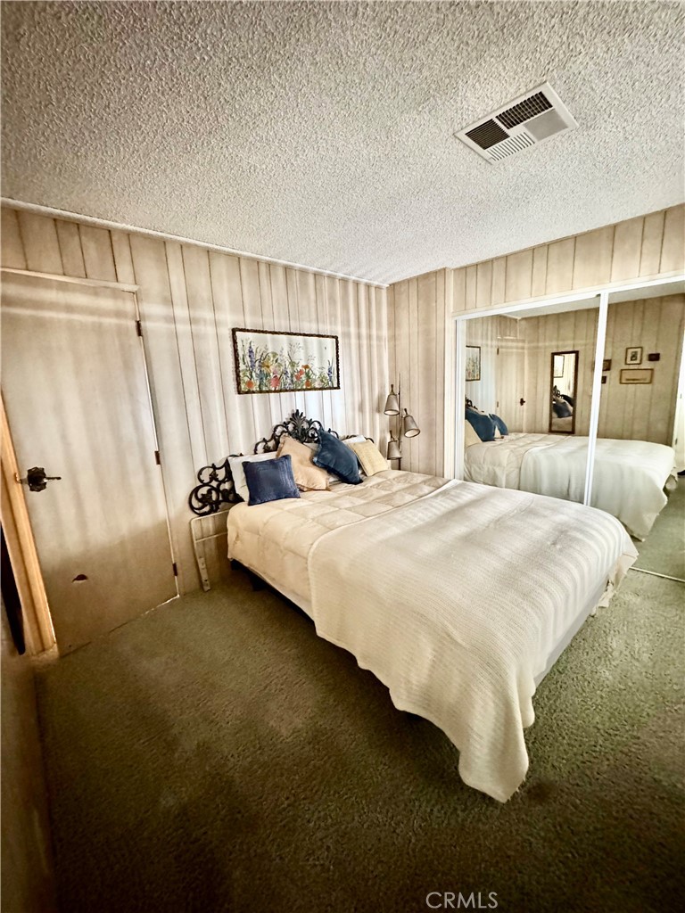 8651 Foothill, Unit 157 Rancho Cucamonga, CA 91730 - Photo 12 of 13 a bedroom with a bed and a window