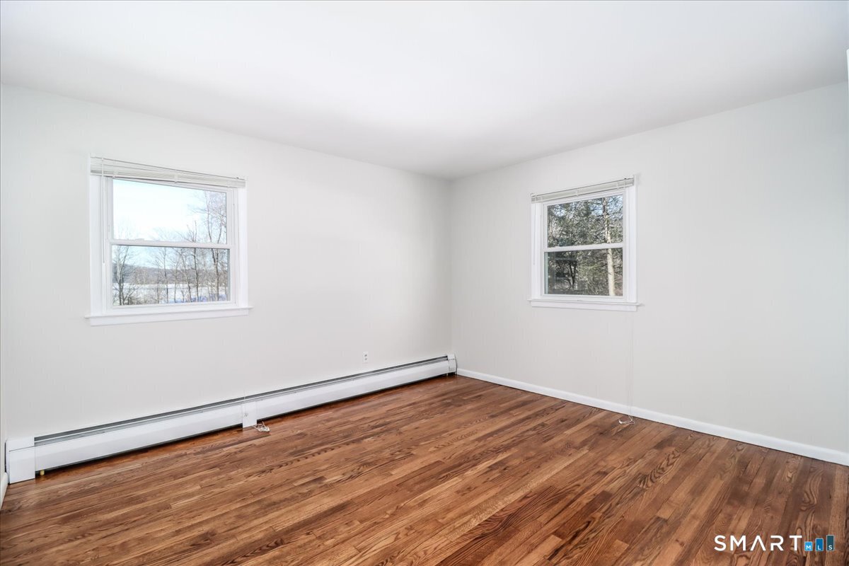 12 South Mountain Road Brookfield, CT 06804 - Photo 14 of 39 an empty room with wooden floor and windows