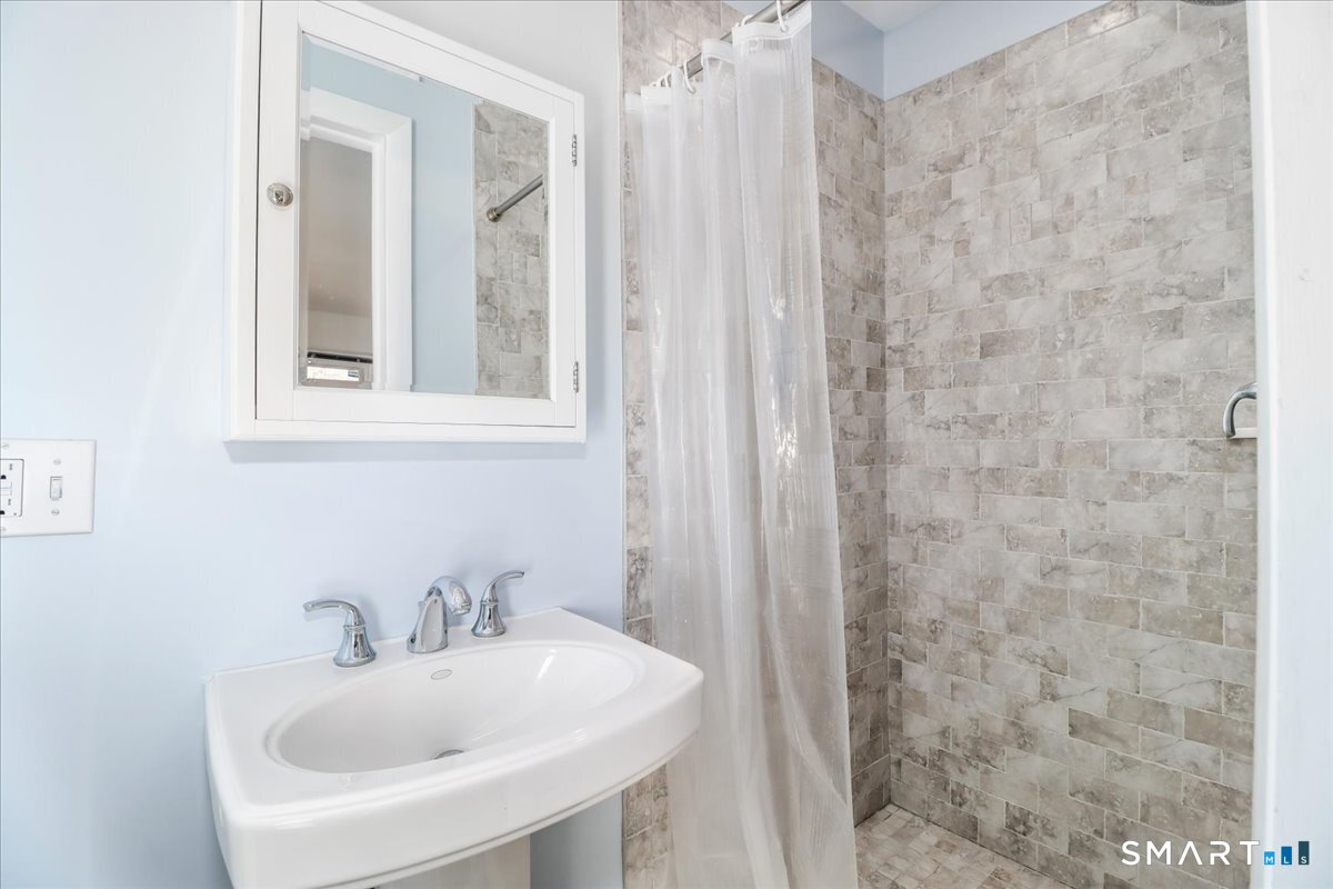 12 South Mountain Road Brookfield, CT 06804 - Photo 16 of 39 a bathroom with a sink and a mirror