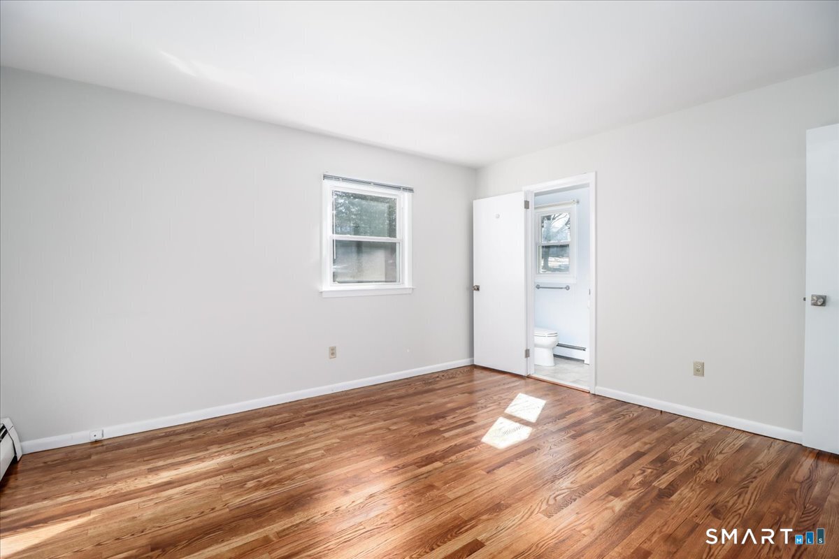 12 South Mountain Road Brookfield, CT 06804 - Photo 18 of 39 an empty room with wooden floor and windows