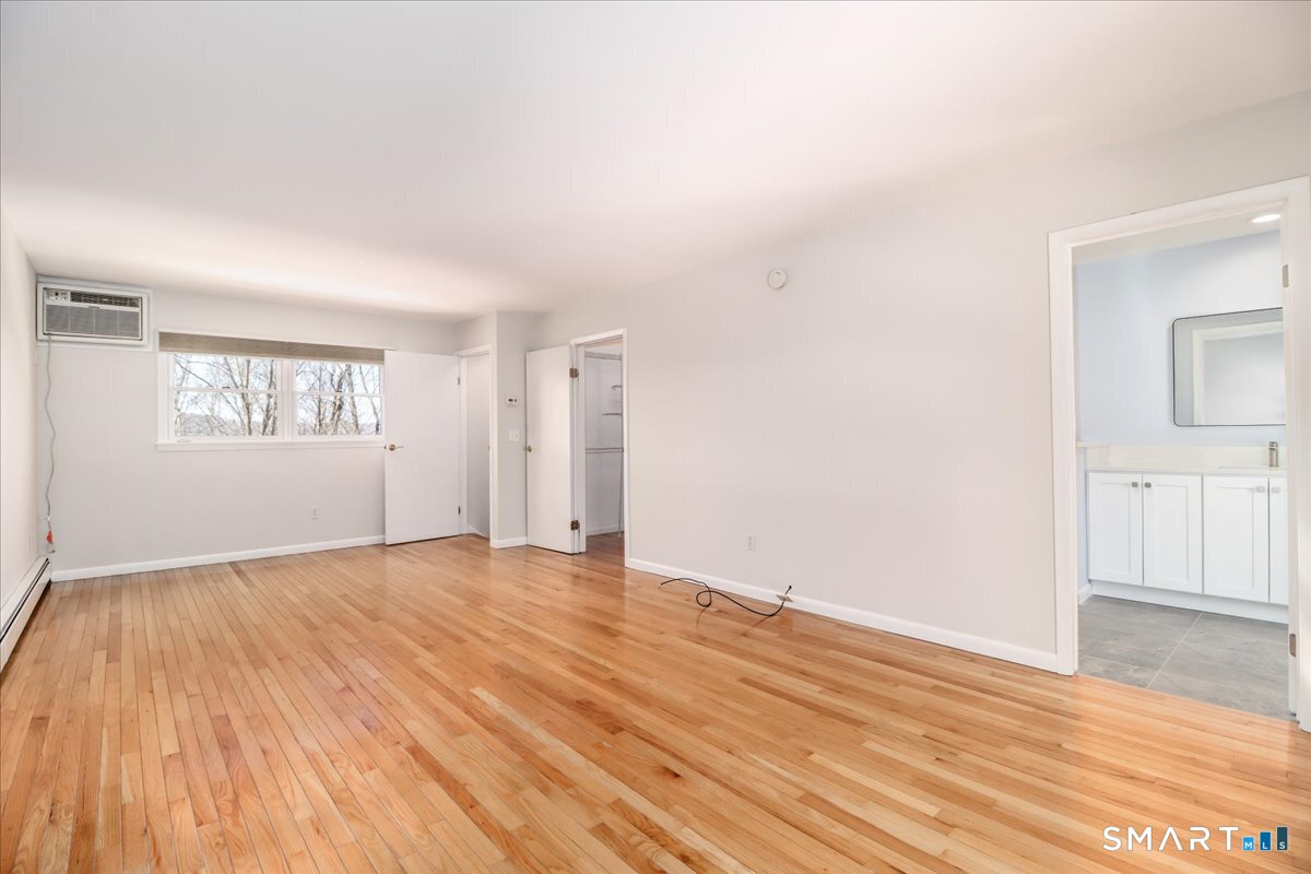 12 South Mountain Road Brookfield, CT 06804 - Photo 20 of 39 an empty room with wooden floor and windows