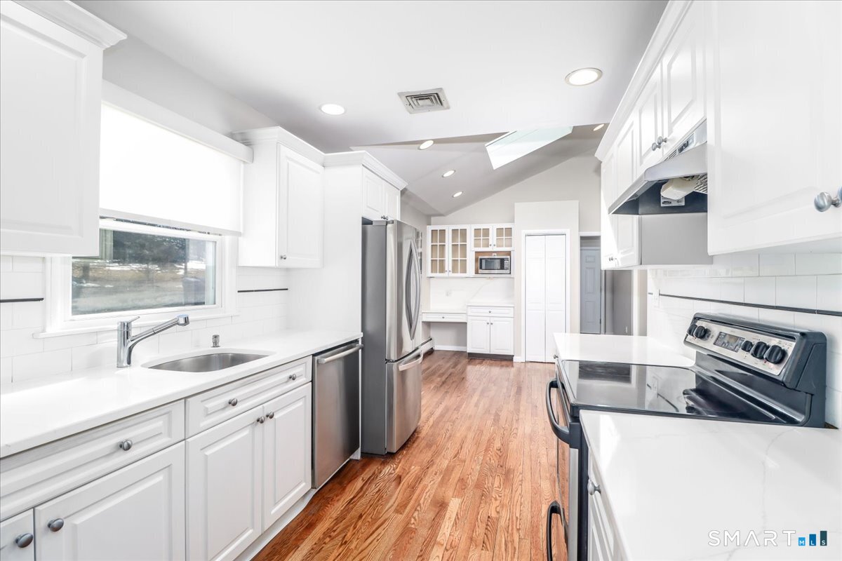 12 South Mountain Road Brookfield, CT 06804 - Photo 2 of 39 a large kitchen with stainless steel appliances lots of counter space and wooden floor
