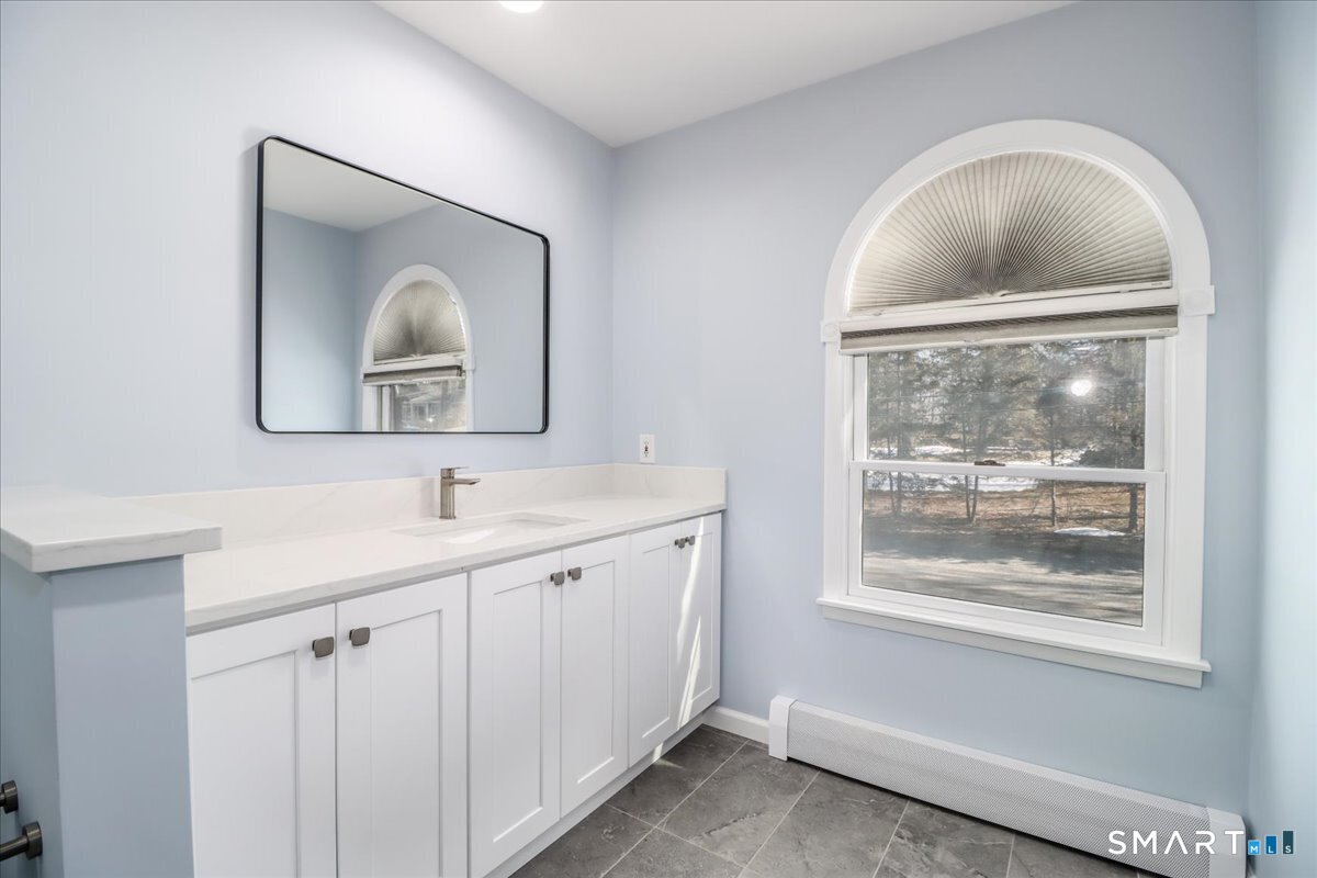 12 South Mountain Road Brookfield, CT 06804 - Photo 22 of 39 a bathroom with 2 sink and a mirror