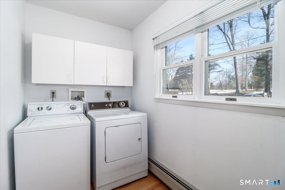12 South Mountain Road Brookfield, CT 06804 - Photo 24 of 39 a view of washer and dryer with bathroom in the background