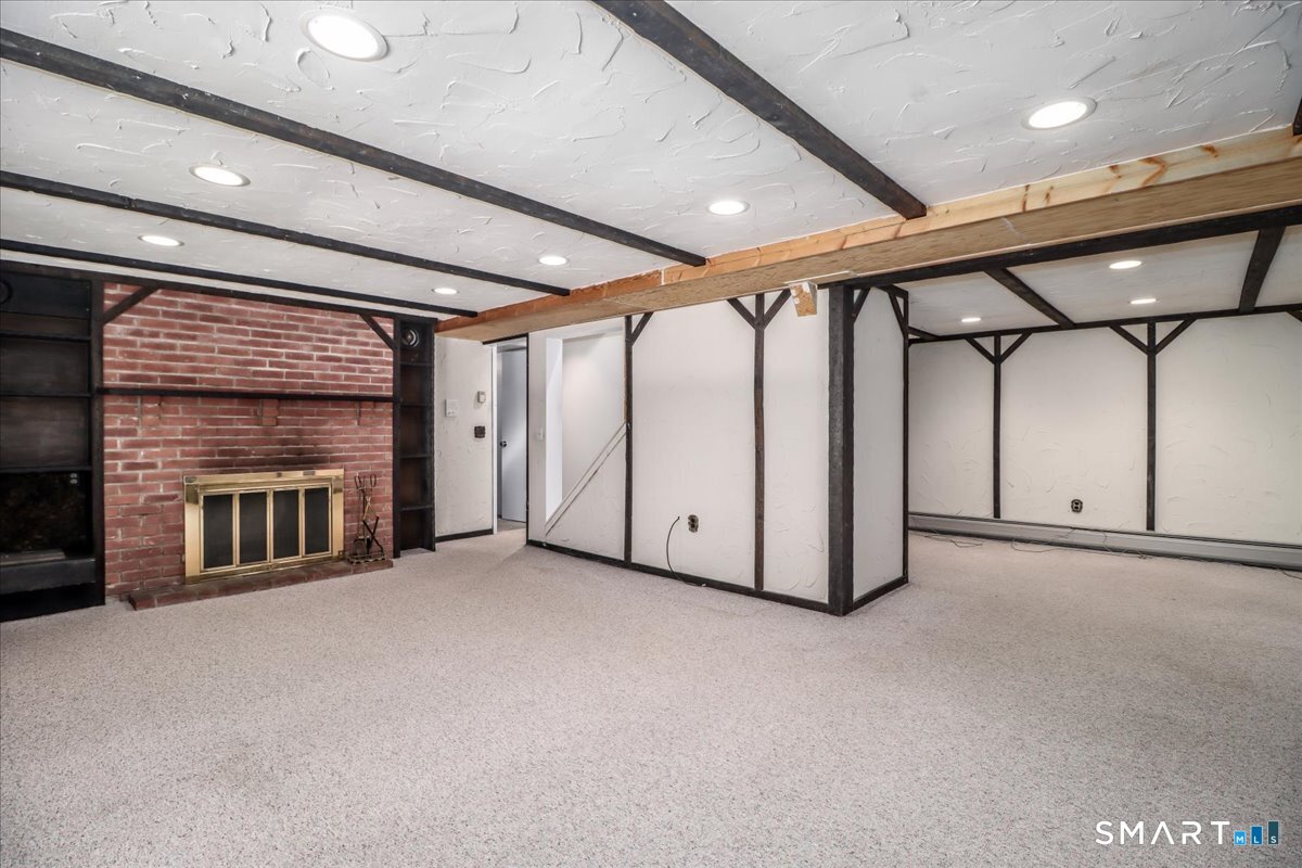 12 South Mountain Road Brookfield, CT 06804 - Photo 27 of 39 a view of an empty room with a fireplace