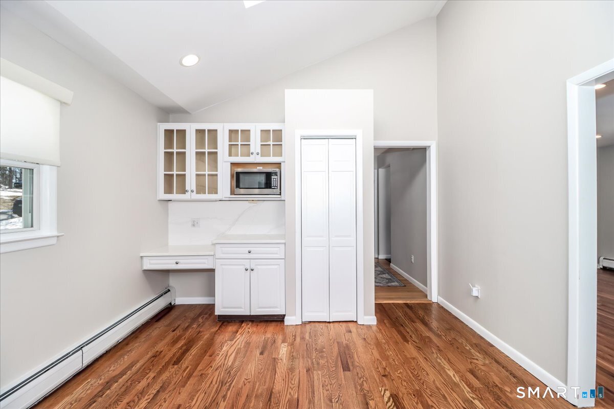 12 South Mountain Road Brookfield, CT 06804 - Photo 3 of 39 wooden floor in an empty room with a window