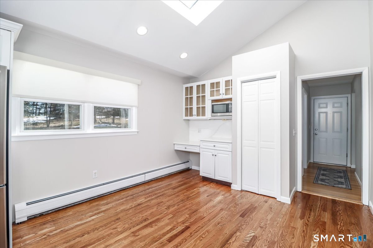 12 South Mountain Road Brookfield, CT 06804 - Photo 4 of 39 a view of a room with wooden floor and window