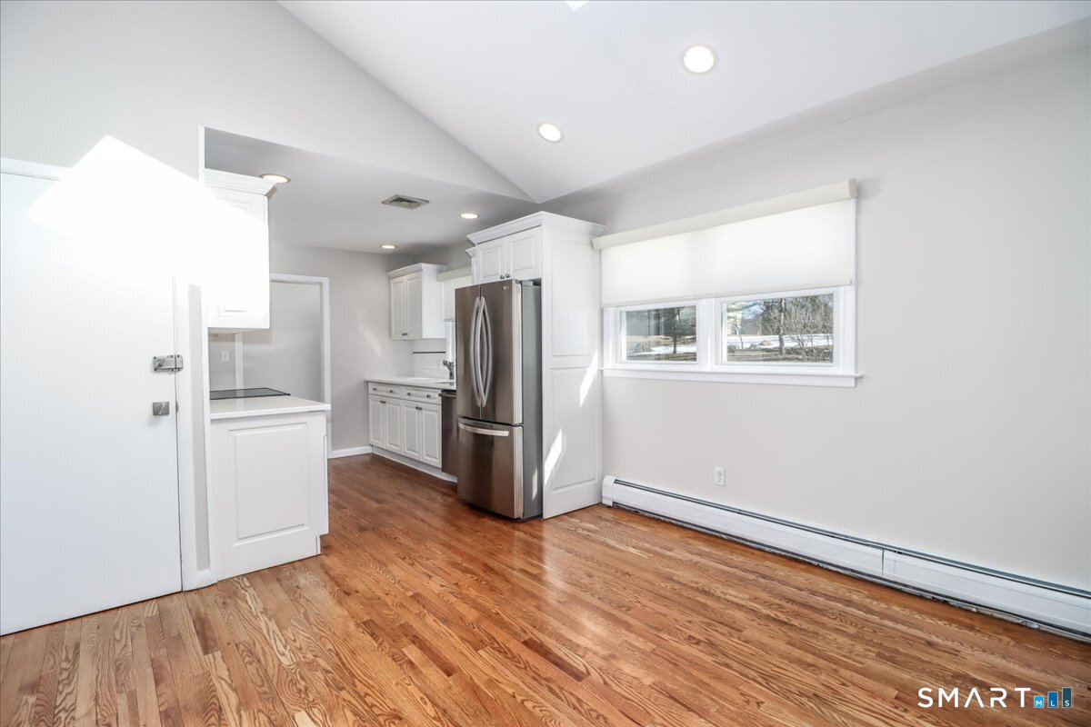 12 South Mountain Road Brookfield, CT 06804 - Photo 5 of 39 a kitchen with stainless steel appliances a refrigerator and a stove top oven