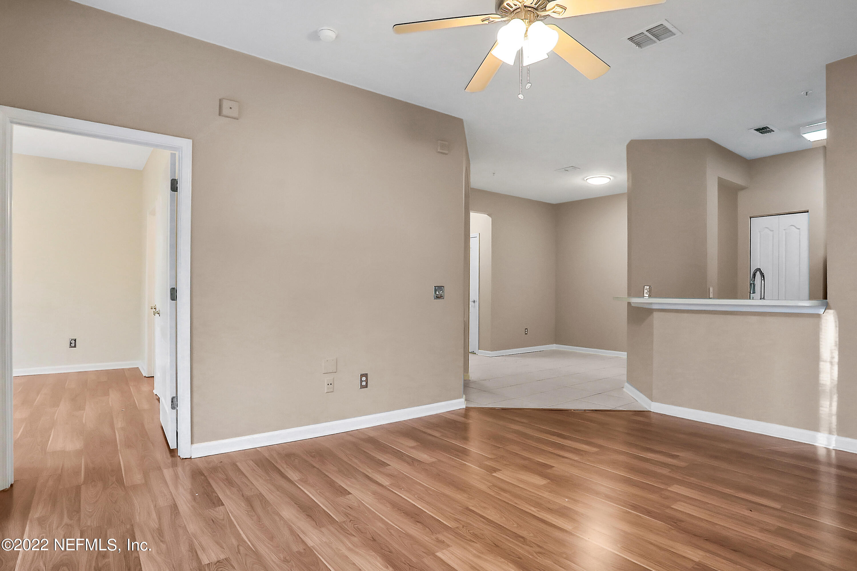 8601 Beach Boulevard, Unit 511 Jacksonville, FL 32216 - Photo 11 of 25 a view of empty room with wooden floor
