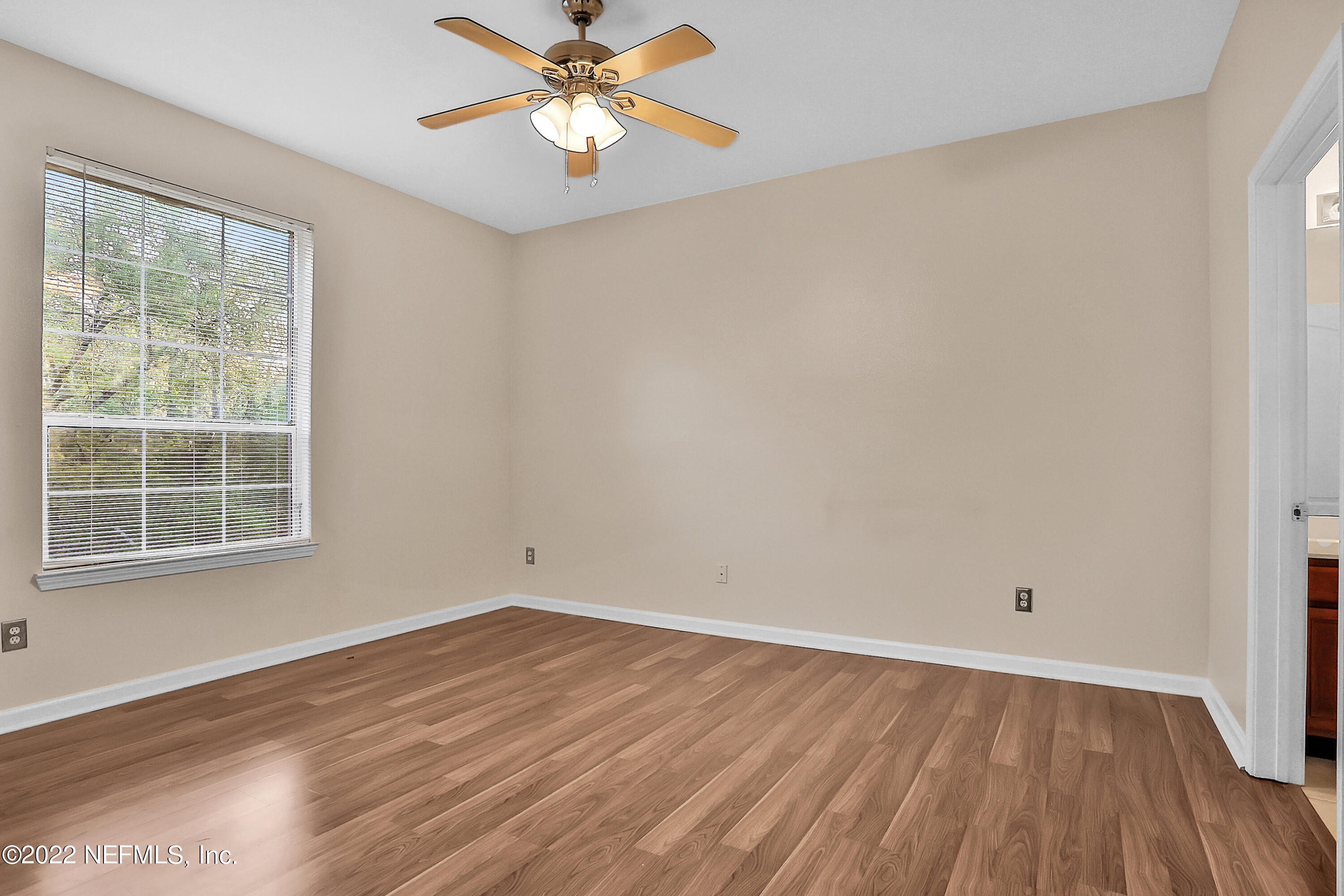 8601 Beach Boulevard, Unit 511 Jacksonville, FL 32216 - Photo 14 of 25 wooden floor in an empty room with a window