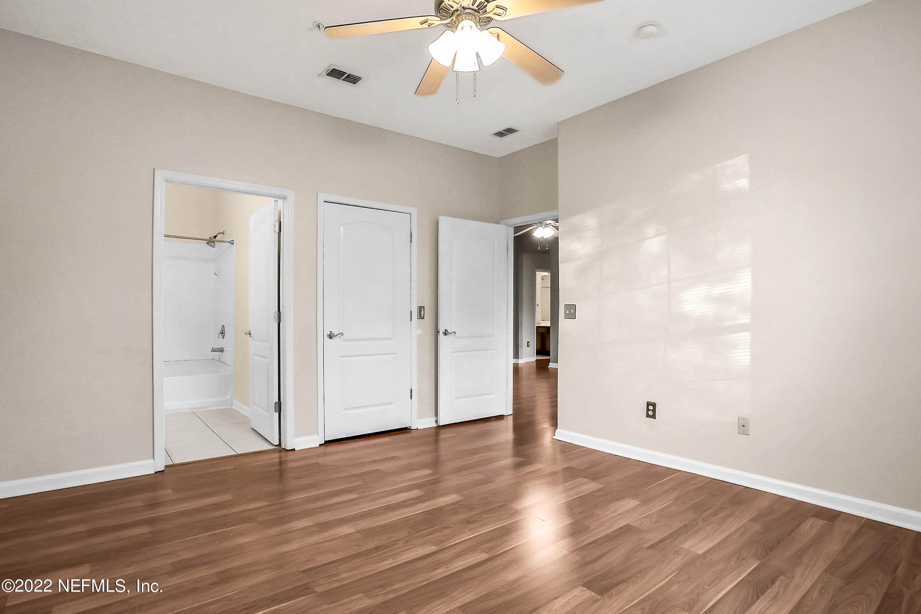 8601 Beach Boulevard, Unit 511 Jacksonville, FL 32216 - Photo 15 of 25 a view of an empty room with wooden floor