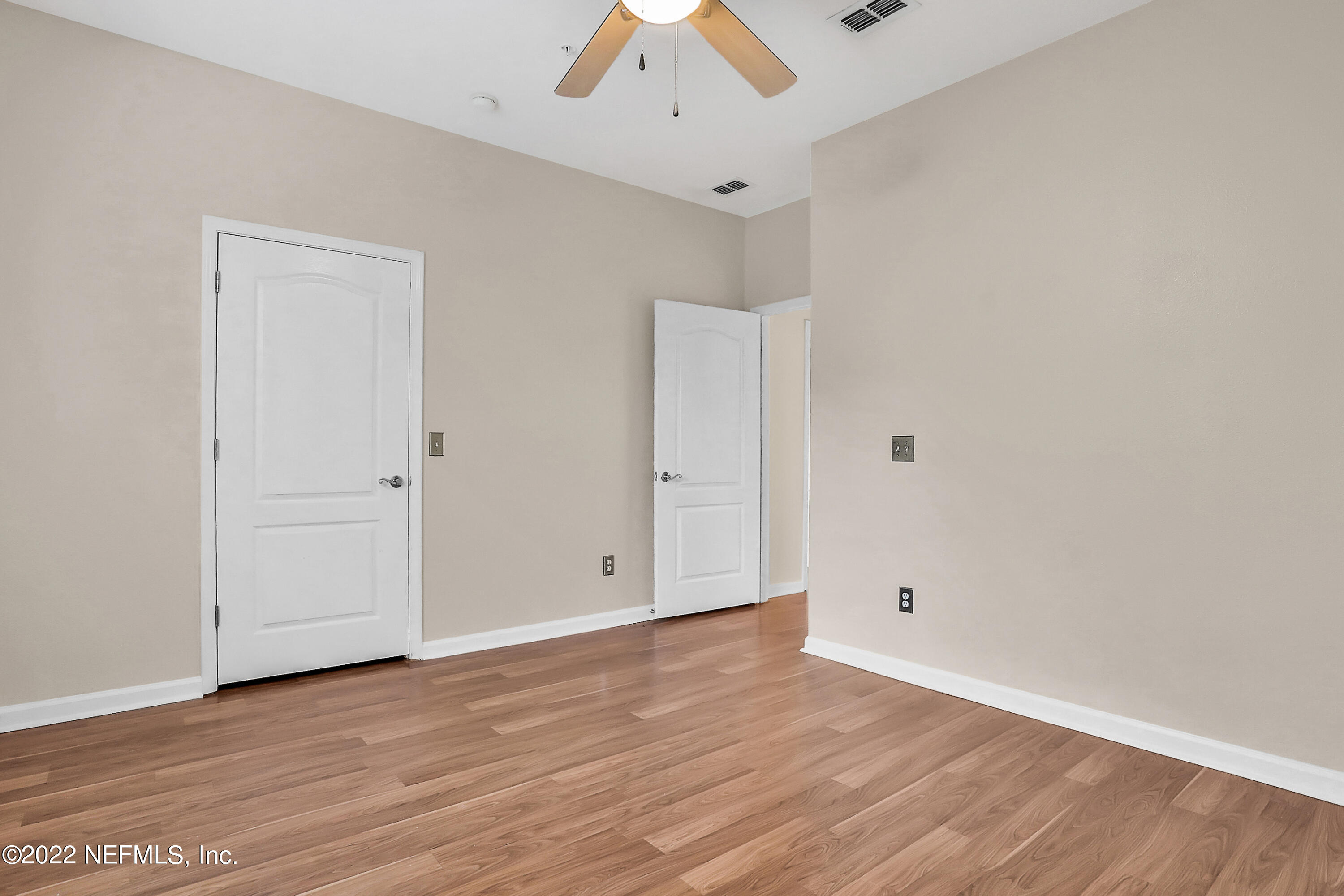 8601 Beach Boulevard, Unit 511 Jacksonville, FL 32216 - Photo 22 of 25 wooden floor in an empty room