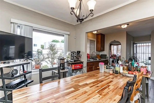 a kitchen with sink a window and cabinets