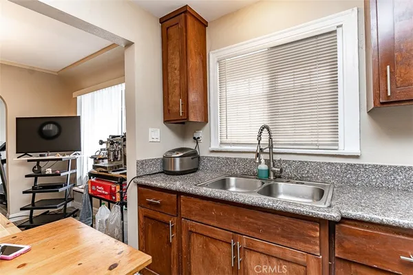 a kitchen with stainless steel appliances granite countertop a refrigerator stove and microwave
