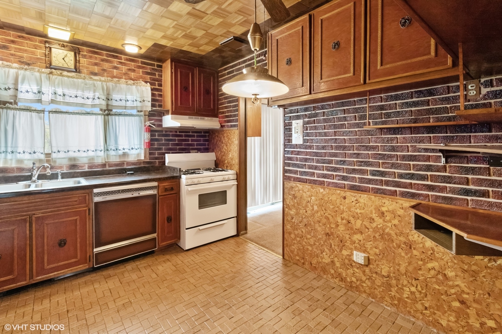 1096 Valley Stream Drive Wheeling, IL 60090 - Photo 8 of 27 a kitchen with stainless steel appliances granite countertop a stove a sink and a microwave